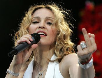 Madonna giving poverty the middle finger